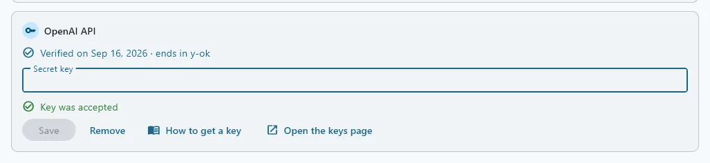 The OpenAI API card after Save: Verified on the date with the key’s last four characters, the box empty again, and a green Key was accepted line under it