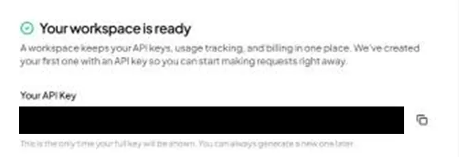 OpenRouter’s Your workspace is ready step: Your API Key, blacked out here, with a copy button beside it, above the line This is the only time your full key will be shown. You can always generate a new one later