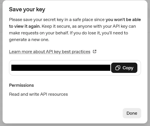 OpenAI’s Save your key window: the key blacked out beside the Copy button, the permissions reading Read and write API resources, and a Done button